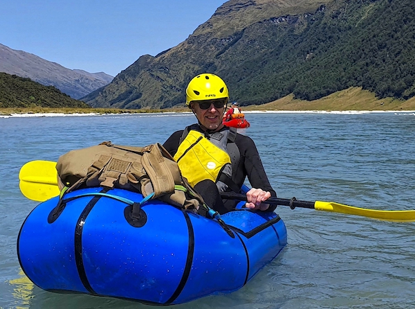 Dr Iain Duncan rafting in New Zealand